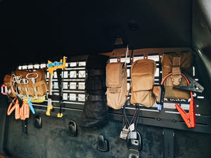 Ram interior molle rear window panel, Rear window molle panel, overland interior rack, Ram interior Molle rack, Ram rear window molle panel. Overland gear organization. Gear mounting for Ram truck. Ram Overland rack. Ram offroad gear. Ram interior organization. Overland interior organization. Icky Concepts.